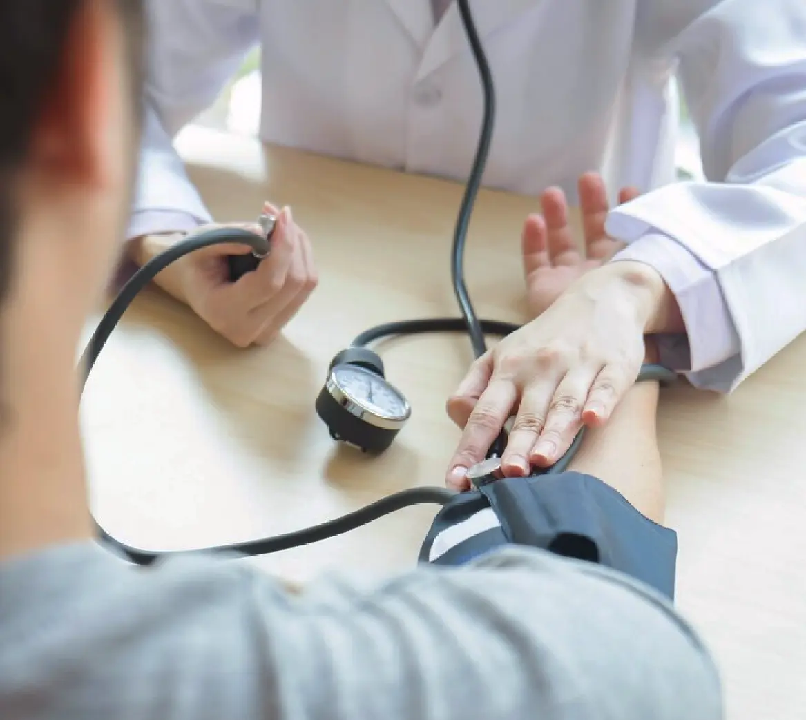 This is an image of a GP checking the patient's blood pressure.